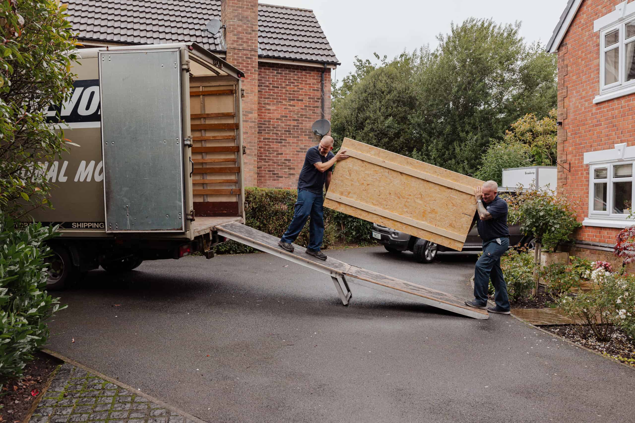 Roy Trevor team loading wooden removal crates