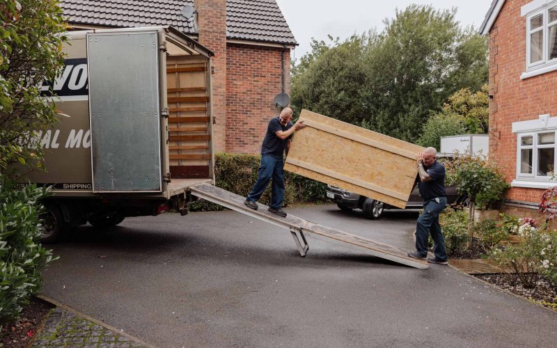 Roy Trevor team loading wooden removal crates